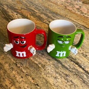 M&M collectible cups Set of two red & green
With hands